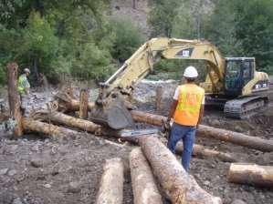 Over 700 cubic yards of varying sized rock was brought in to reconstruct the streambed and over 30 ponderosa pine rootwads where used to construct log