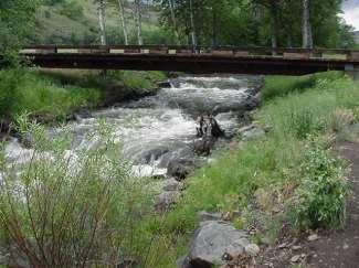NYCD removed an old bridge with an associated abandoned irrigation diversion structure and replaced it with 5 vortex rock weirs to provide fish passage.