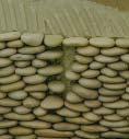 The pebbles and stones are a natural product, meaning that not two pieces are exactly alike. It is not unusual to find veins and lines of separation in the pebbles.