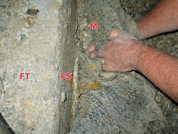Rock may also have been forced between the overlaps where they were not nailed to the concrete. The membrane leaked.