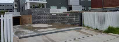 Rising water levels cause an automatic response, elevating the isolation barrier via floatation. Gate system retracts below pavement as water levels decrease.