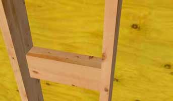Install two blocks between interior studs where railing