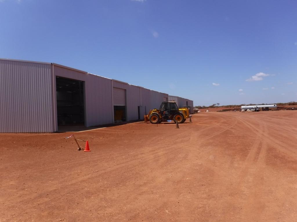Photo 5: Workshop and Warehouse Construction Complete Tailings Storage Facility and Evaporation Pond: The tailings storage facility (TSF) construction is 75% complete