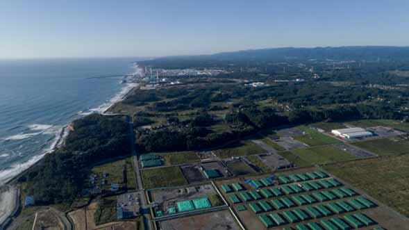 2 Summary Nuclear Waste Storage, Futaba, with Fukushima Daiichi nuclear plant in background, 29 September 2017, Christian Aslund/Greenpeace Japan As a result of the Fukushima Daiichi nuclear accident