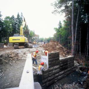 T - W A L L The T-WALL Retaining Wall System is a gravity structure constructed of individual precast T-WALL units.