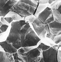 Fracture surface have faceted texture because of different orientation of cleavage planes in grains. B.