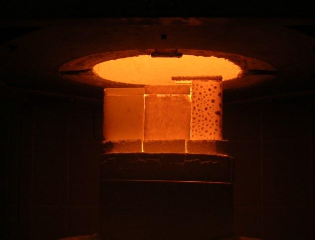Fig. 5 Selected refractory materials in the elevator furnace with temperature 1400 C, there was a local creation of sintered cristobalite (blue arrowed);( i) chamotte, ii)