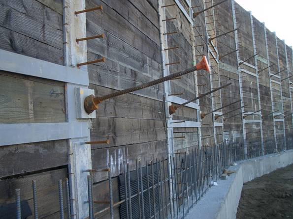 Retaining wall with tiebacks H-shape steel