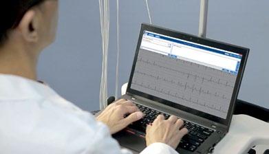 The report review screen is designed with a large ECG display area similar to a traditional ECG printout for easier