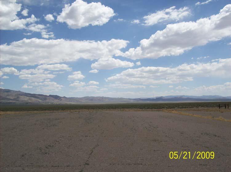 property, facing west from western end of runway.