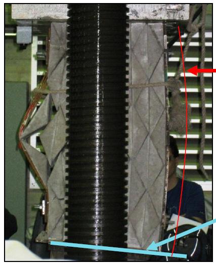 4 Loading of the concrete specimen reinforced with steel wire mesh showing displacement and rotation of the prisms. Fig.
