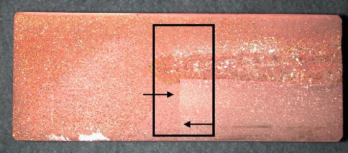 Figure 3-4. Exposed sample revealing canister material and lid material.