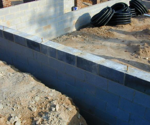 1.5 Exterior surface of below-grade walls finished as follows: For poured concrete, concrete masonry, and insulated concrete forms, finish with