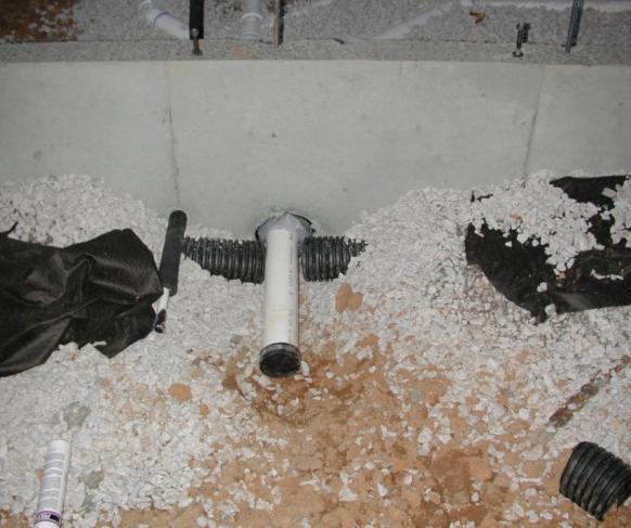 1.8 Drain tile surrounded with clean gravel and fabric filter 9 B The drain tile is cut and now does not extend