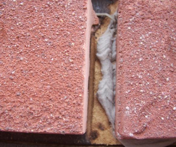 2.1 Flashing at bottom of exterior walls with weep holes included for masonry