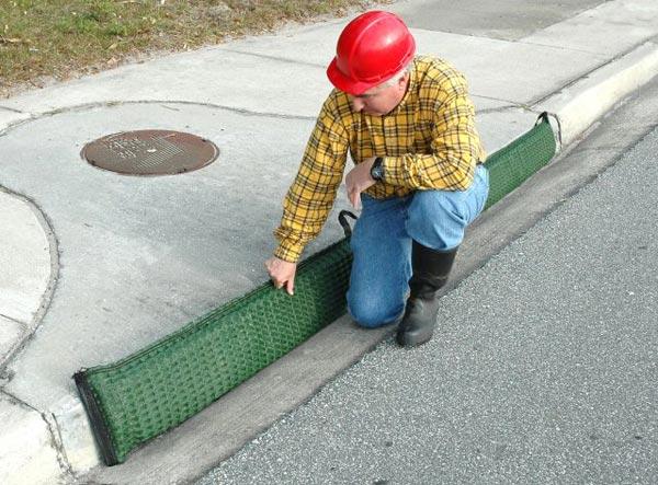 (Photo courtesy of Mark Dilley, Interstate Products, Inc.) Figure 4.20. Commercially Available Gutter Guard Being Replaced.
