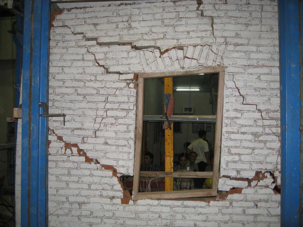 In both cases, crack initiated at the corner of window frame and formed diagonal cracking from there. At the end of the experiment, both models show similar failure mechanism.