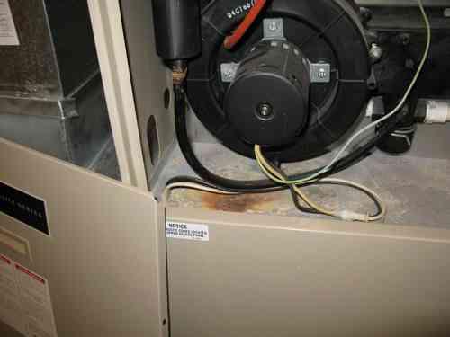 There were visual indication of previous water leaks inside furnace induce fan compartment (possibly from furnace condensation line) at the time of inspection.