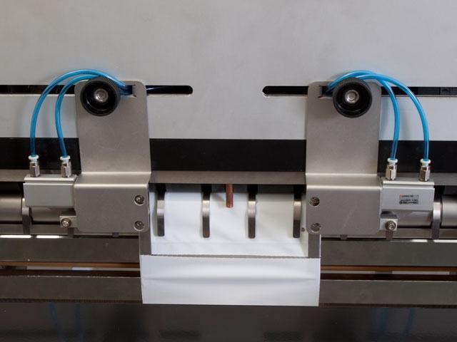 Adjustable Hole Punch Pneumatic punch that puts a small perforated hole (flutter vent) in the