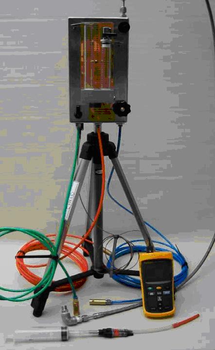Test unit enclosure shown mounted on the table top tripod with the blue, red and green 6mm diameter plastic water
