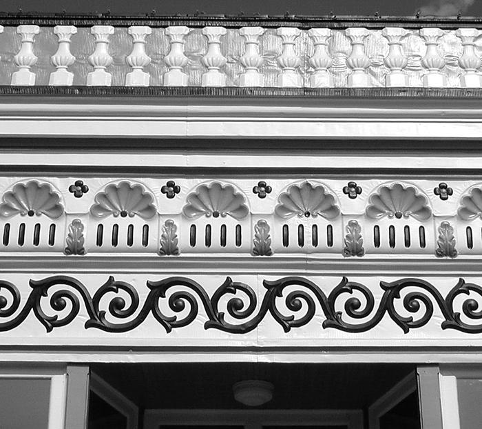 Porches, turned columns and brackets, cornices, storefronts, foundations, and window and door surrounds are examples of architectural details that should not be removed or altered.