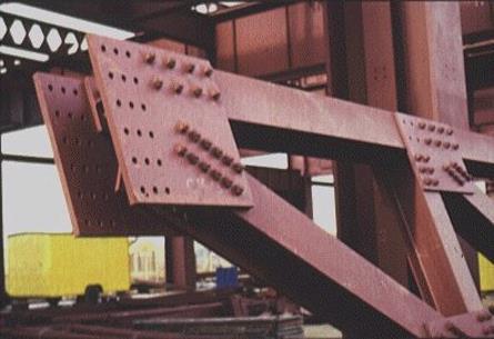 Joint of a truss made by riveting. Joint of a truss made by welding.