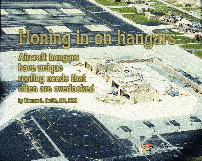 Photo 1: A substantial amount of roof deck material blew off these hangars. At one hangar, many trusses also were blown away. Two nearby fighter aircraft appeared to be damaged, as well.