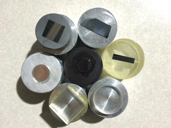 Figure 1 Samples mounted to standard aluminum or epoxy metallographic mounts. The diameter of the mount is 1.25 (32mm).