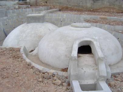chamber. Figure 2: Photo of a fixed dome biodigester before covering with earth.