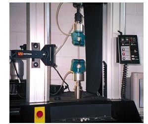 c. Volumetric Compression Test setup Fig.4 Uniaxial Tension rod Fig.7 A Volumetric Compression Test setup Fig.5 A Tension Experiment using a Video Extensometer b.