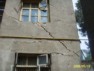 phenomena of through diagonal cracks or through X-shape cracks on the wall are shown in Figure 1.