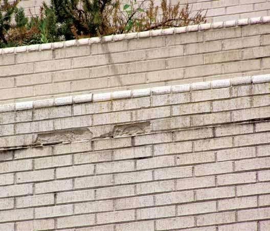 modification or repair? Also, if there has been a modification, what, if anything, has been done to the parapet wall?