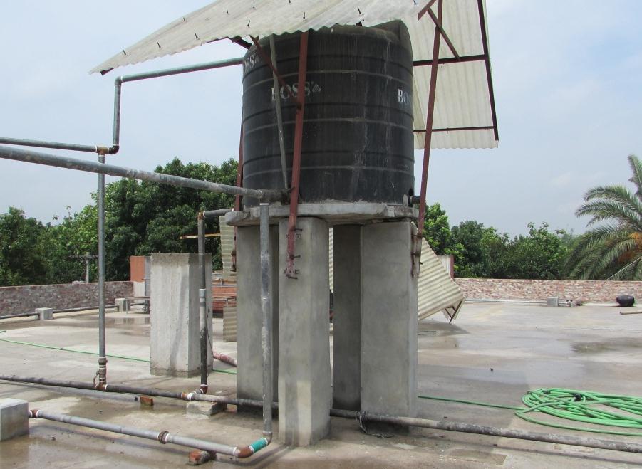 As the 2 nd floor is the flat slab, so the tank put beside the column will cause the concentrate load to