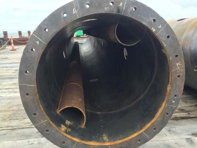 Figure 8. Steel pipe jetting and pile driving guide. Jetting was provided through steel pipe and was controlled by tubular channels welded to the steel pipe sides.