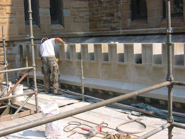 The entire front parapet was in serious disrepair and was replaced with new stone and flashings.