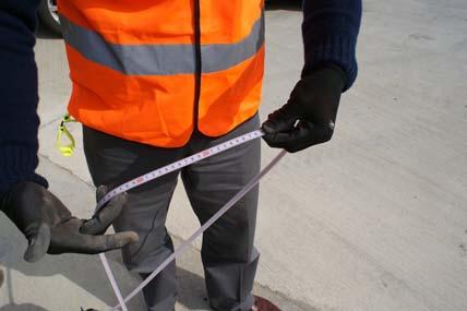top of the borehole/pipe/ reference Step 8: Without moving your thumb, lift the tape up to read the