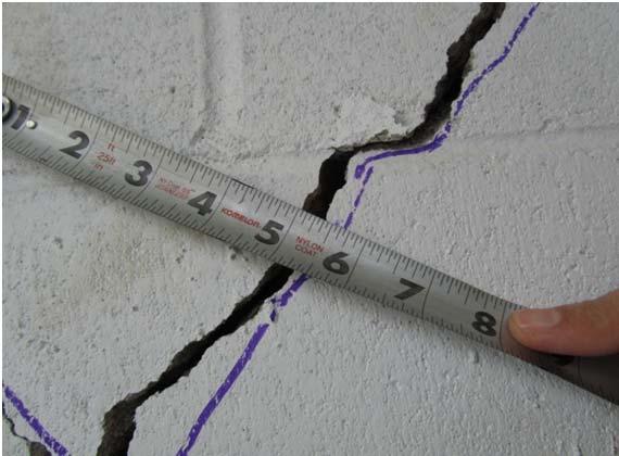 Finally, at the end of the test, Figure 21 shows how wide shear cracks had opened in Wall 1 and Wall 3 at the ground level.