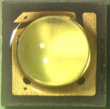 one piece silicone lens. The LED die and protection diode sit on top of a copper plate.