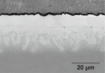 T T (a) Superalloy (b) Fig. 1 SEM-BSE micrographs of two SPS systems after heat treatment: a AM1-2. The black arrow shows small cavities formed because of foil stacking. b AM1-5.