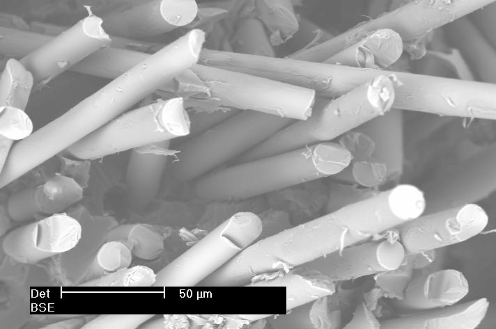 a) b) Fig. 7. SEM images: a ) 55%w of fibers; b) 45%w of fibers. The influence of fibers content on the impact properties of the recycled material is reported in Fig. 8.