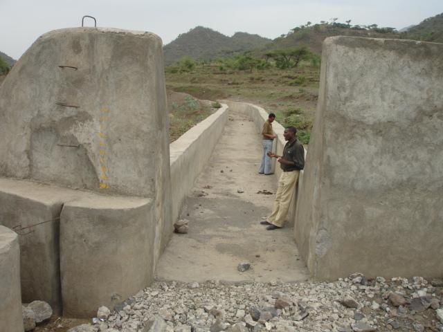 inlet with a deflection angle of less than 60 degrees for smooth diversion of flood