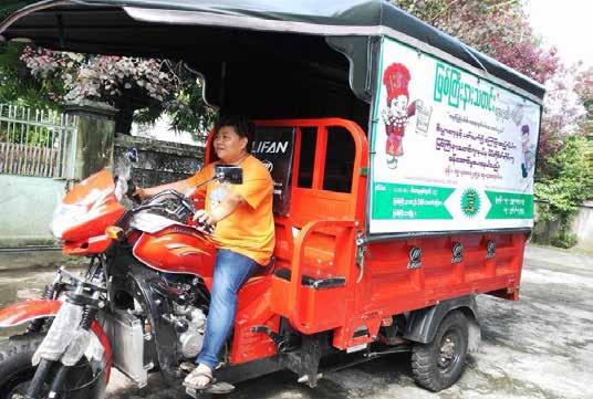 MOVING FORWARD MNJ founder and chief editor Seng Mai driving the distribution trishaw.