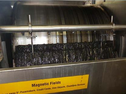 Magnetite is recovered from the waste activated sludge and reused.