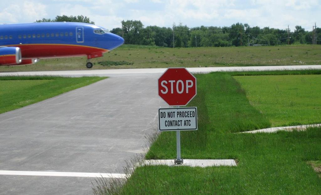 Airport Operator Actions to Reduce the Potential for Pedestrian and Ground Vehicle Deviations Service roads that enter runways should have signs