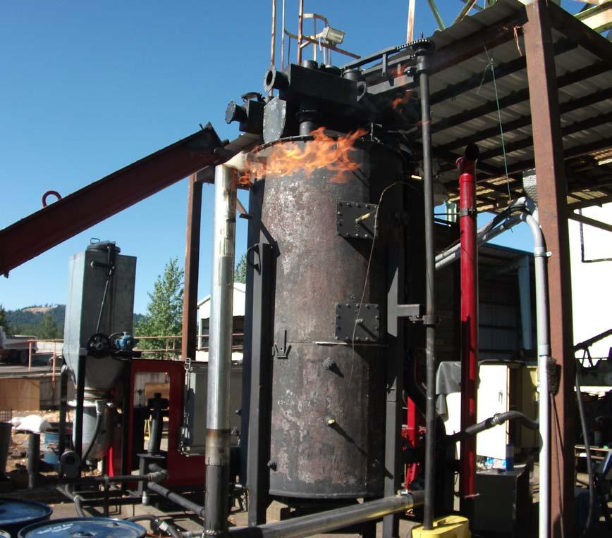 A Fluidyne Pacific Class down-draft gasifier provides thermal drive for the entire system.